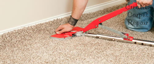 Carpet stretching with a power stretcher